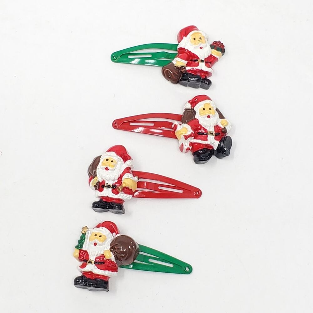Vintage Plastic and metal santa hair clips set of 4 Great condition